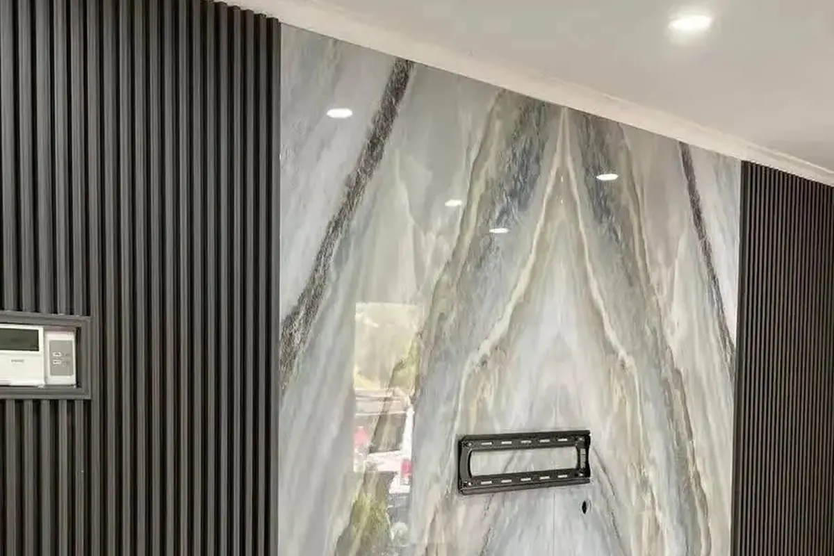Book-matched marble wall panel in a finished Foxrun project in Noida